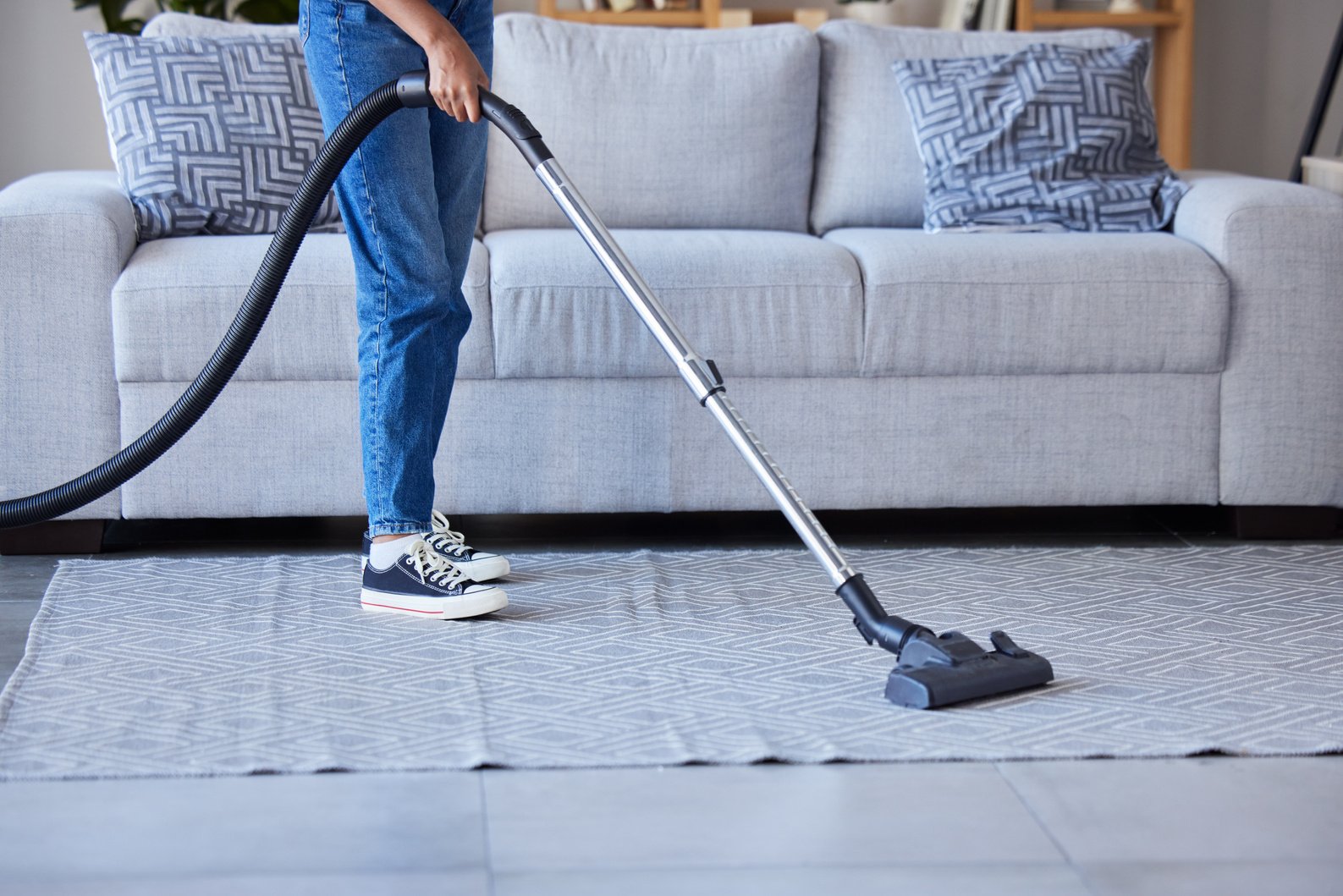 Woman, Vaccum and Cleaning Living Room Floor or Carpet for Home Hygiene, Housework and Maid Spring Cleaning. Cleaner, House Maintenance and Service Lady Dust Dirt on Rug or Housekeeping in Lounge